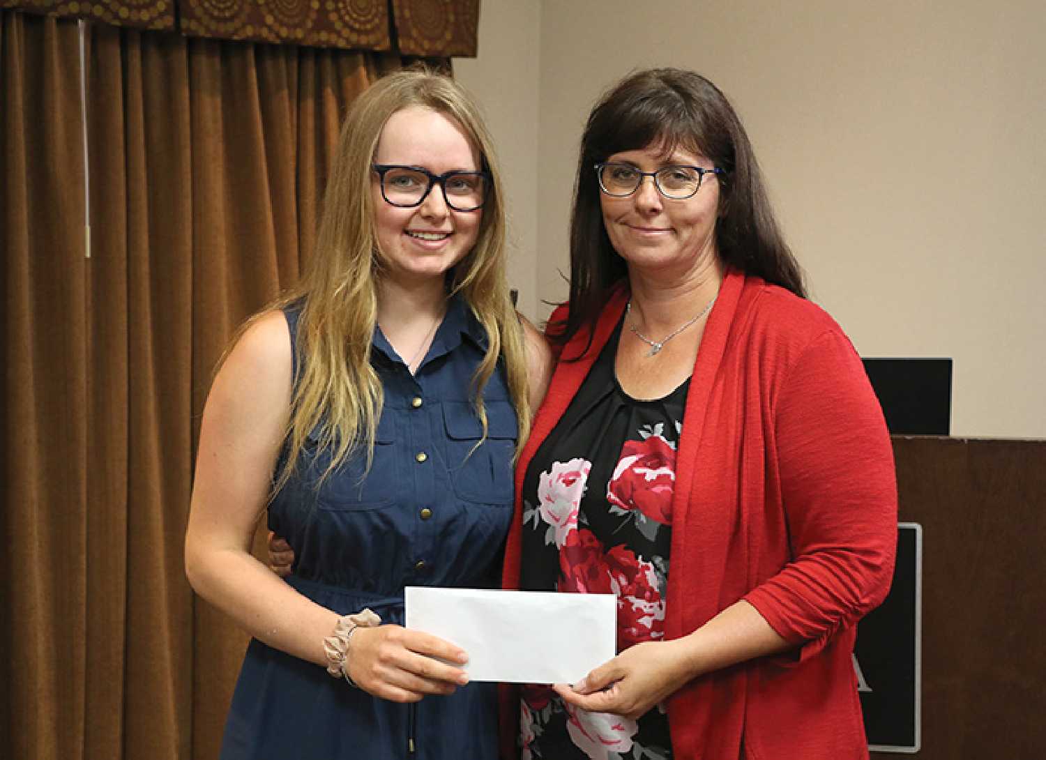 Ricayla Gawryluk of Whitewood presented her donation of $3,384 for the Moosomin Airport Expansion Project to RM of Moosomin CAO Kendra Lawrence, at Tuesday’s Moosomin Chamber of Commerce meeting. 